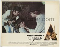 3c376 CLOCKWORK ORANGE LC #4 1972 c/u of Malcolm McDowell grabbing his friend's face, Kubrick!