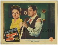 3c821 SHADOWS IN THE NIGHT LC 1944 Warner Baxter as The Crime Doctor helps Nina Foch with her coat!