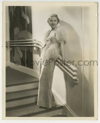 3m427 GENEVIEVE TOBIN 8.25x10 still 1930s the Fox actress in feathered outfit on deco stair rail!