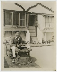 3m720 NORMAN FOSTER 8x10.25 still 1934 smoking by typewriter outside his Malibu Beach cottage!