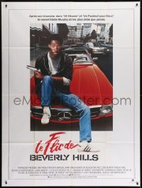 3p612 BEVERLY HILLS COP French 1p 1985 great image of cop Eddie Murphy sitting on Mercedes!