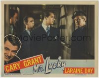 3z726 MR. LUCKY LC 1943 close up of gambler Cary Grant & Charles Bickford starring at each other!