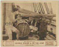 3z756 ON THE JUMP LC 1918 great c/u of George Walsh aiming cannon on ship, directed by Raoul Walsh!