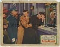 4p810 SPELLBOUND LC 1945 Alfred Hitchcock, Ingrid Bergman holds Gregory Peck buying train tickets!