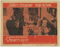 4p915 VERTIGO LC #5 1958 Alfred Hitchcock, standing James Stewart on phone,blonde Kim Novak in bed!