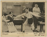 5b827 NIP & TUCK LC 1923 two women try to free stuck tailor Billy Bevan as Harry Gribbon watches!