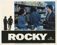 5b871 ROCKY LC #7 1976 Sylvester Stallone tries to talk to Talia Shire at the grocery store!