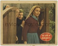5h833 SONG OF BERNADETTE LC 1943 close up of Jennifer Jones walking through wooden gate!