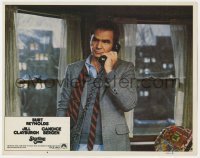 5h848 STARTING OVER LC #4 1979 close up of Burt Reynolds with loose tie talking on phone!