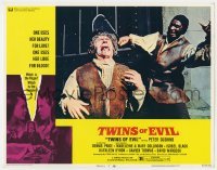 5h940 TWINS OF EVIL LC #7 1972 gruesome image of man getting struck in the head with a huge blade!