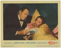 5h983 WRONG MAN LC #2 1957 Alfred Hitchcock, Henry Fonda in tuxedo with Vera Miles in bed!