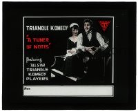 5m581 TUNER OF NOTES glass slide 1917 Triangle Komedy, man & pretty woman sitting on piano!