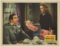5r409 DANCE HALL LC 1941 seated Cesar Romero looks up at Carole Landis by breakfast table!