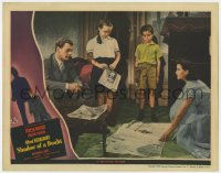 6b219 SHADOW OF A DOUBT LC 1943 Joseph Cotten watches Teresa Wright spread newspapers on floor!