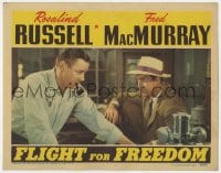 6m379 FLIGHT FOR FREEDOM LC 1943 Fred MacMurray stares quizzically at Herbert Marshall smoking pipe