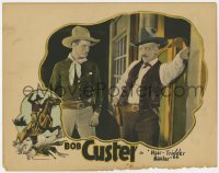 6m440 HAIR TRIGGER BAXTER LC 1926 cowboy hero Bob Custer stares down bad guy outside saloon doors!