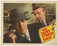 6m786 SAINT STRIKES BACK LC 1939 detective George Sanders on the phone as Jonathan Hale watches!