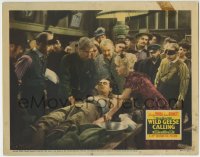 6m975 WILD GEESE CALLING LC 1941 Joan Bennett tending to wounded Henry Fonda on table by crowd!
