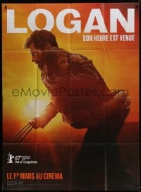 6t884 LOGAN teaser French 1p 2017 Jackman in the title role as Wolverine holding Dafne Keen!