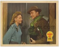 7c517 FRENCH KEY LC 1946 pretty Evelyn Ankers smiles at Albert Dekker carrying potted plant!