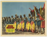 7c613 JUNGLE STAMPEDE LC #4 1950 great image of African native tribal warriors lined up!