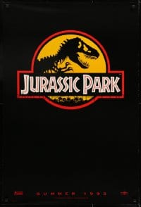 7g719 JURASSIC PARK teaser 1sh 1993 Steven Spielberg, classic logo with T-Rex over yellow background