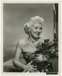7h131 BETTY GRABLE 8x10 key book still 1950s great smiling close up holding bouquet of roses!