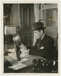 7h246 CONFLICT 8x10.25 still 1945 Humphrey Bogart comparing handwriting on letter & photo!