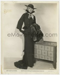 7h404 GLENDA FARRELL 8x10 still 1934 wearing wild dress with hat, gloves & holding fur!