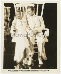 7h413 GOLD DIGGERS OF 1937 8.25x10 still 1937 Dick Powell & Joan Blondell in giant rocking chair!