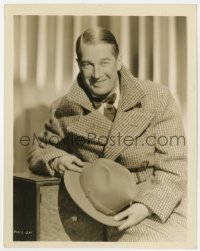 7h630 MAURICE CHEVALIER 8x10.25 still 1930s great smiling portrait in large coat & holding hat!