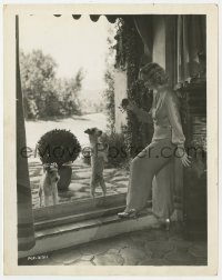 7h645 MIRIAM HOPKINS 8x10.25 still 1930s teasing her dogs with ball on other side of the window!