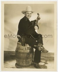 7h894 TEX RITTER 8x10.25 still 1936 sitting with a guitar on his knee, Headin' for the Rio Grande!