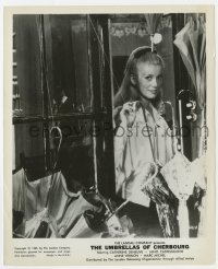 7h936 UMBRELLAS OF CHERBOURG 8.25x10 still 1965 great portrait of Catherine Deneuve in doorway!