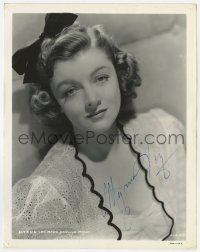7s562 MYRNA LOY signed 8x10.25 still 1930s head & shoulders portrait at MGM with a bow in her hair!