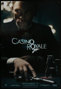 8a170 CASINO ROYALE teaser DS 1sh 2006 Craig as James Bond sitting at poker table w/gun!