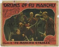 8d411 DRUMS OF FU MANCHU chapter 1 LC 1940 Asian thugs shove man into a box, Fu Manchu Strikes!