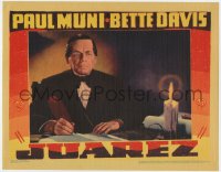 8d595 JUAREZ LC 1939 close up of Paul Muni in the title role writing by candlelight, very rare!