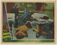 8d596 JUNGLE CAPTIVE LC 1945 Phil Brown, Jerome Cowan, Vicky Lane as the Ape Woman laying on floor!