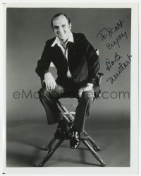 8y658 BOB NEWHART signed 8x10 REPRO still 1980s great smiling portrait sitting in director's chair!