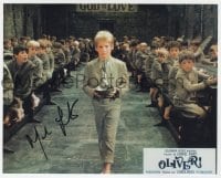 8y583 MARK LESTER signed color 8x10 REPRO still 1980s as Oliver Twist about to please ask for more!