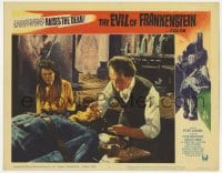 9b250 EVIL OF FRANKENSTEIN LC #3 1964 Katy Wild is puzzled by Peter Cushing working on his monster!