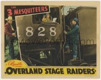 9b652 OVERLAND STAGE RAIDERS LC 1938 bad guy holds train engineer at gunpoint, Three Mesquiteers!