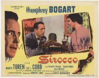 9b783 SIROCCO LC #7 1951 close up of Humphrey Bogart examining Marta Toren's bracelet!