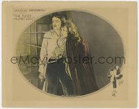 9b879 THREE MUSKETEERS LC 1921 Douglas Fairbanks as D'Artagnan faces swords through a door!