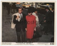 9h009 BREAKFAST AT TIFFANY'S color 8x10 still 1961 Audrey Hepburn & Peppard holding hands on street!