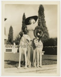 9h453 GOIN' TO TOWN 8x10.25 still 1935 Mae West in sexy dress & fur with Russian wolfhounds!