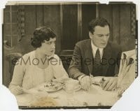 9h976 WHY CHANGE YOUR WIFE 8x10.25 still 1920 Gloria Swanson stares at Thomas Meighan at table!