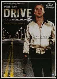 9j317 DRIVE Italian 1p 2011 best close up of Ryan Gosling as the driver holding hammer!