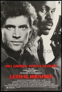 9w739 LETHAL WEAPON 1sh 1987 great close image of cop partners Mel Gibson & Danny Glover!
